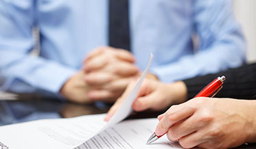couple signing papers